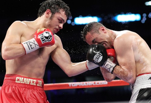 Julio Cesar Chavez Jr lands a good left hand against Marco Antonio Rubio in his last title defense. Chavez Jr went on to win a decision and remain undefeated.
