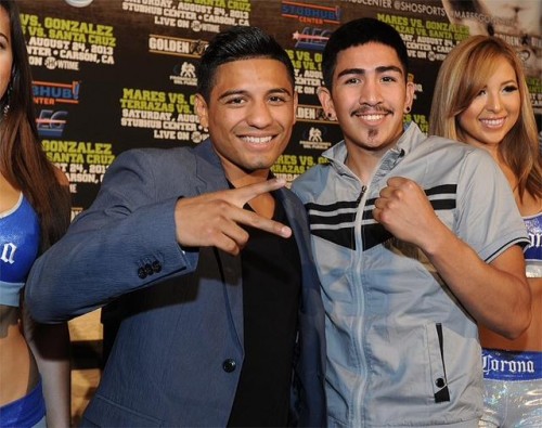 WBC Featherweight World Champion Abner Mares (Left) and former IBF Bantamweight World Champion Leo Santa Cruz (Right) pose on July 11, 2013 in Los Angeles, California at the press conference to officially announce their August 24, 2013 fights. Photo by Carlos Delgado - Hoganphotos
