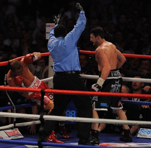 Carl Froch of Britain (R) knocks down Lu Carl Froch